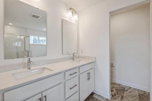 (Photo of a similar home, actual homes finished will vary) The primary bath.