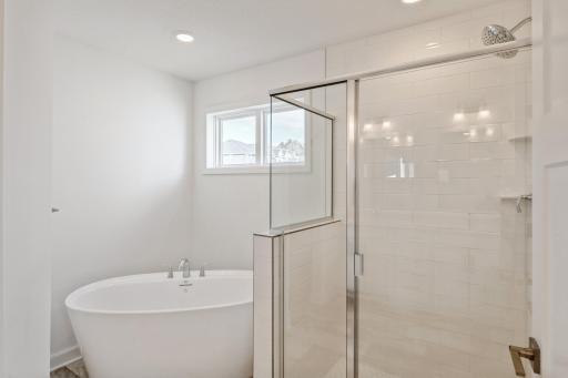 (Photo of a similar home, actual homes finished will vary) The primary bath.