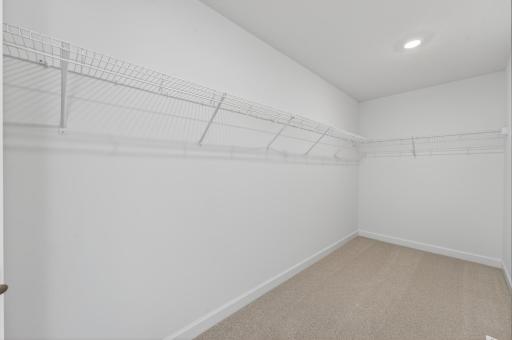 (Photo of a similar home, actual homes finished will vary) The primary bedroom features an amazing walk-in closet.