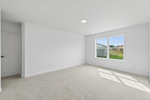 (Photo of a similar home, actual homes finished will vary) One of the three secondary bedrooms.