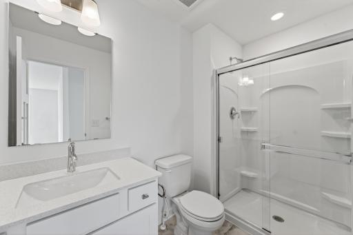 (Photo of a similar home, actual homes finished will vary) One of the secondary bedrooms has an en-suite bath.