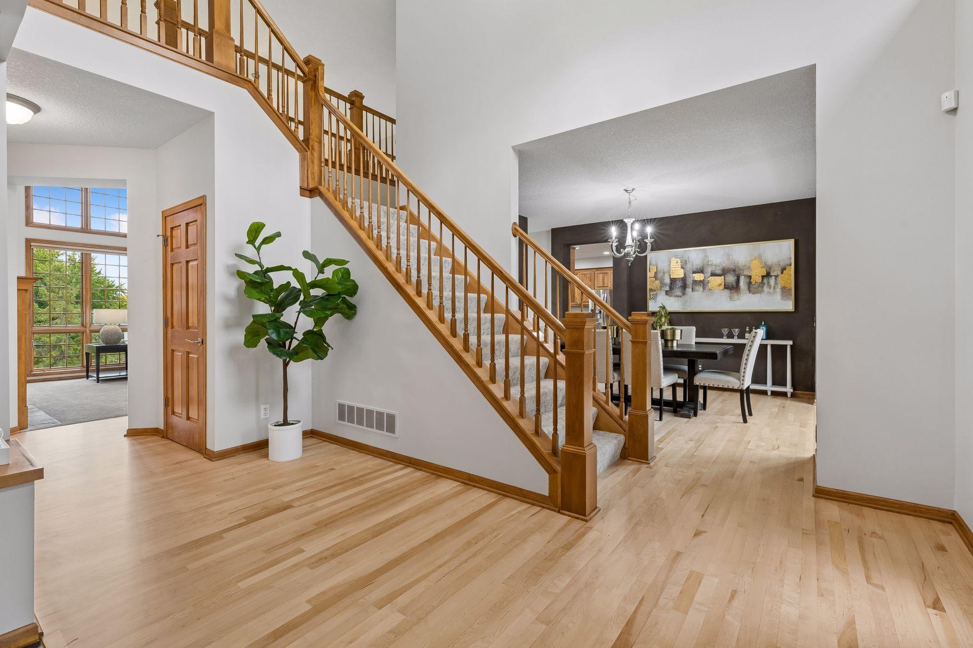 NEW Hardwood floors finished in WOW 2 story grand entry