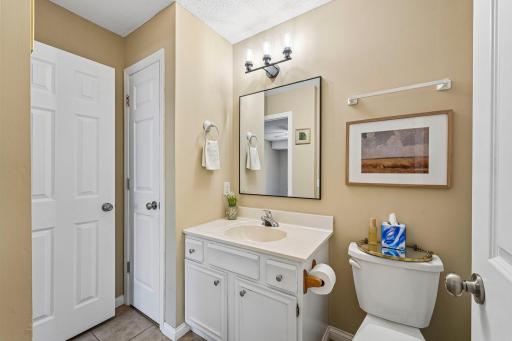 Trendy upper level bathroom with direct access to the primary bedroom