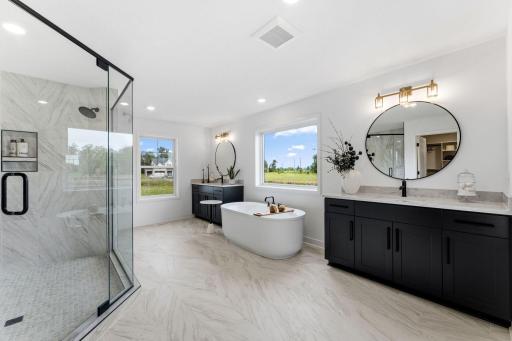 A standalone tub and split vanities will elevate and simplify everyday routines