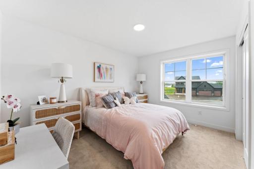 The secondary bedrooms are comfortable spaces offering a personal retreat away from the main living areas.