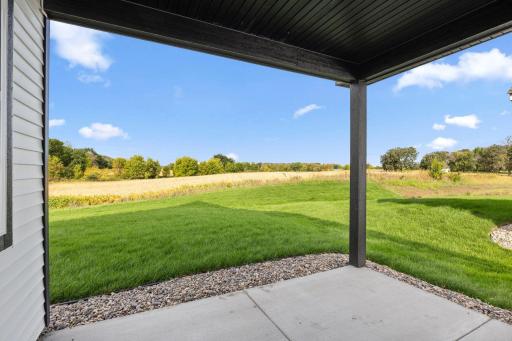 The covered patio expands the home for al fresco dining experiences, intimate outdoor gatherings in the fresh air and relaxing activities shaded from the sun.