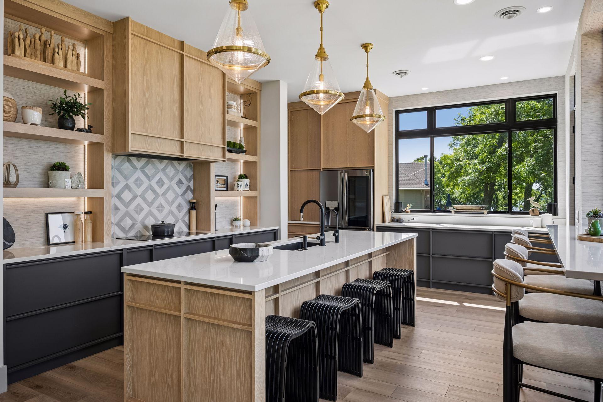 Custom designer lighting serves as both a functional feature and a work of art, complementing the kitchen's clean lines and Scandinavian-inspired aesthetic.