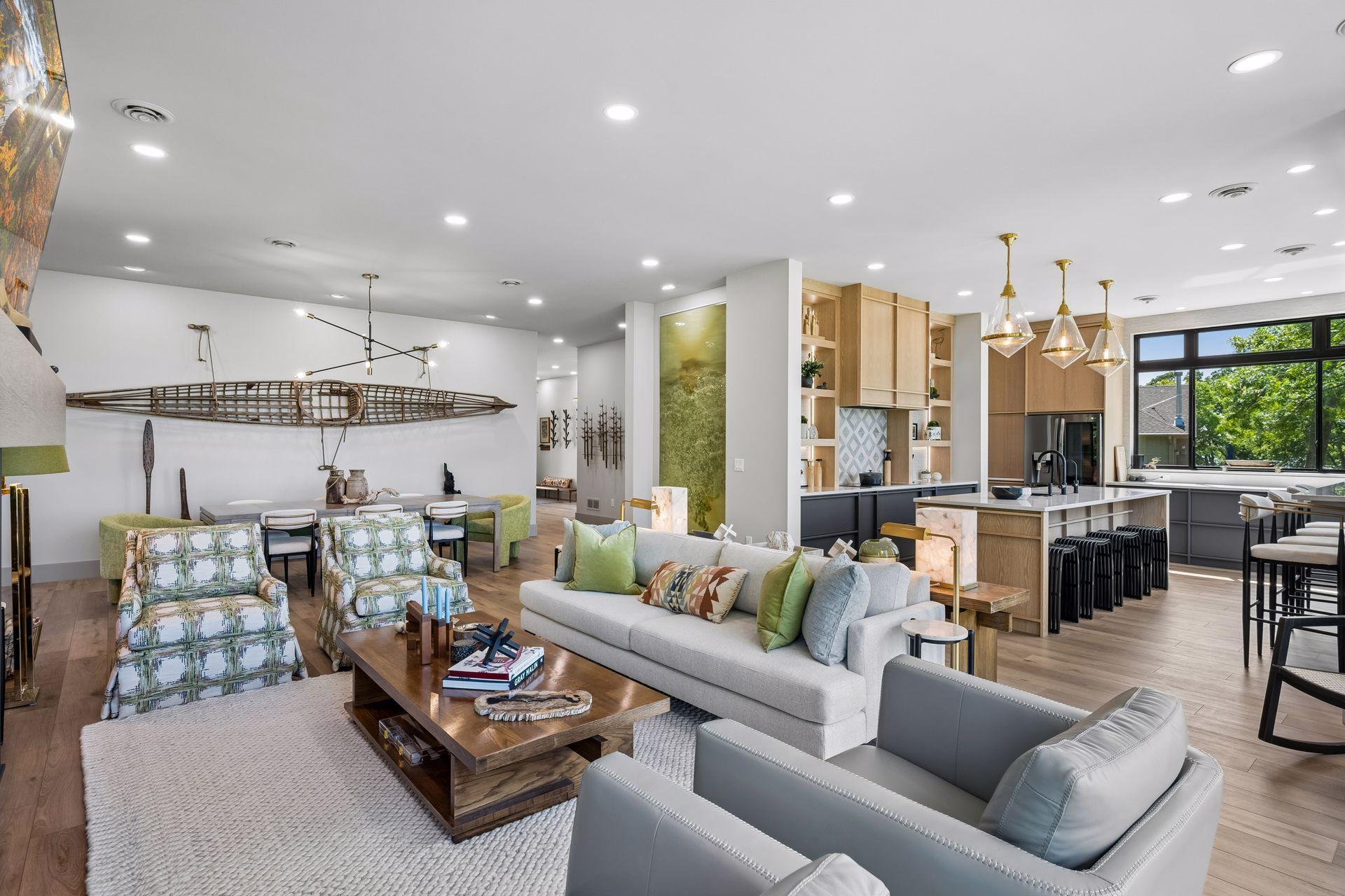 The living room flows seamlessly into the kitchen and dining area, creating an open-concept design that is ideal for everyday living and effortless entertaining.