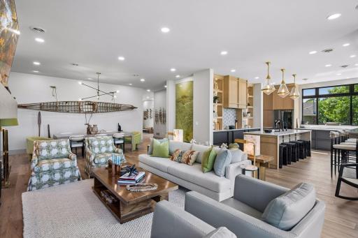 The living room flows seamlessly into the kitchen and dining area, creating an open-concept design that is ideal for everyday living and effortless entertaining.