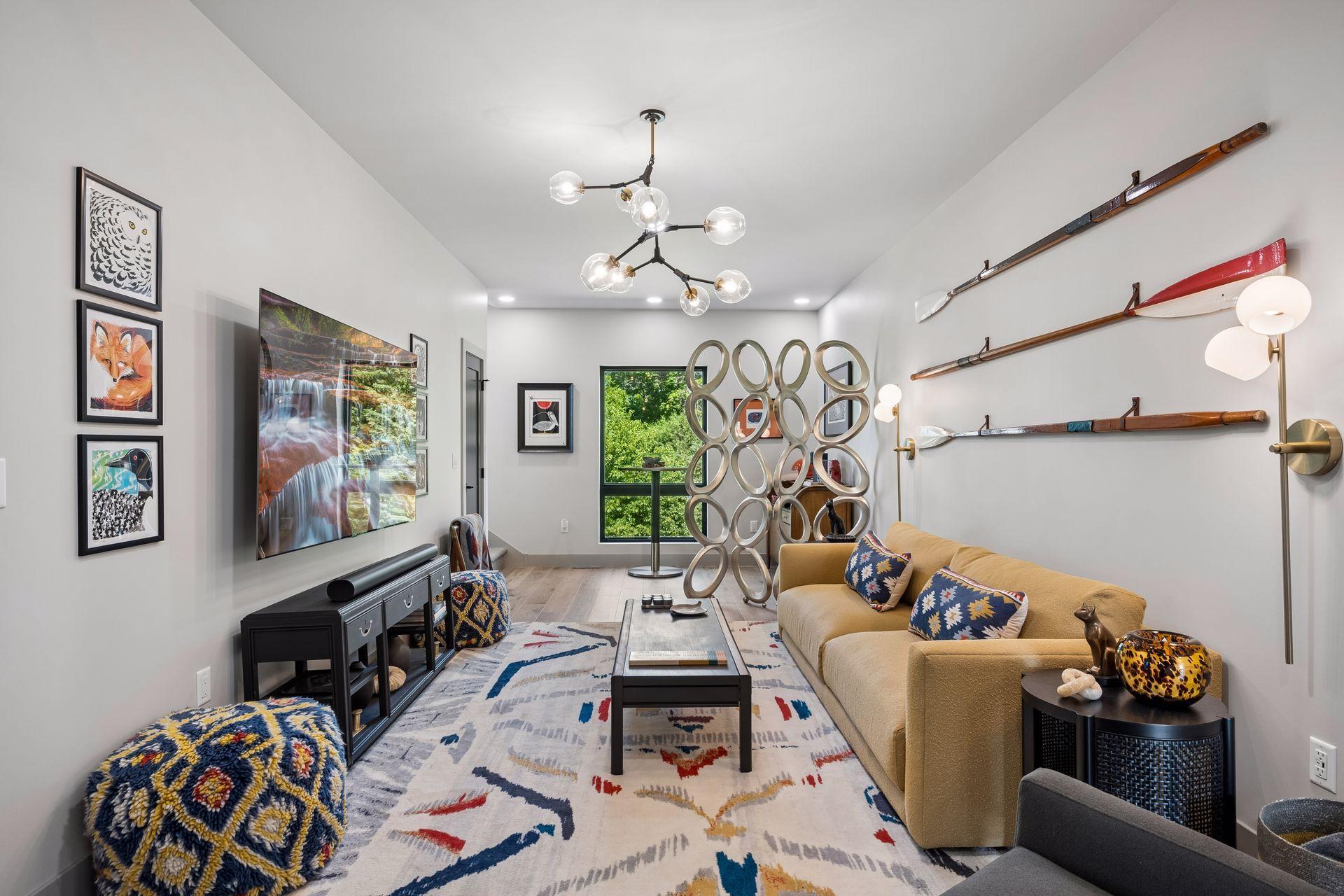 The media and gaming loft provides a fun and flexible retreat for movie nights, gaming, or relaxing. An adjacent coffee bar adds convenience, creating the perfect space unwind.