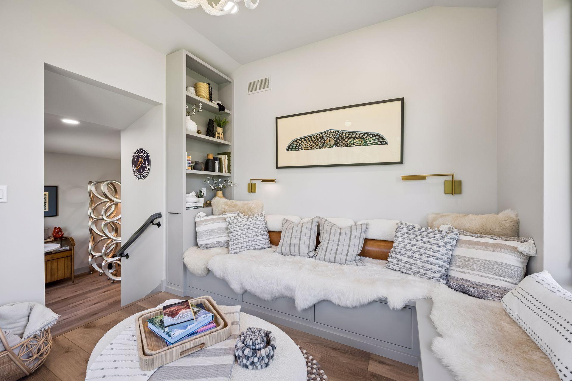Filled with natural light, this inviting space features custom built-in seating and provides the perfect setting for morning coffee, afternoon reading, or sunsets over the water.