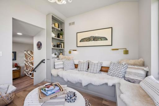 Filled with natural light, this inviting space features custom built-in seating and provides the perfect setting for morning coffee, afternoon reading, or sunsets over the water.
