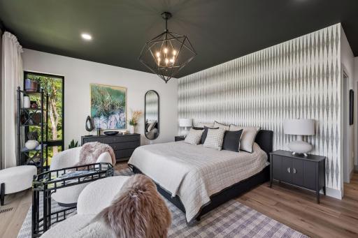 Thoughtfully designed with a striking accent wall, custom finishes, and a private balcony, this serene sanctuary offers the perfect place to unwind while enjoying spectacular sunsets over the lake.
