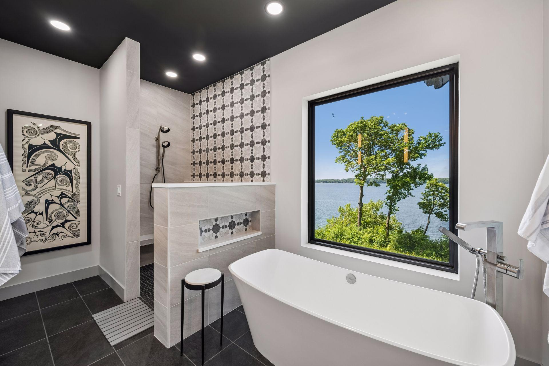 A spacious walk-in tile shower with designer finishes, dual-sink vanity, and thoughtfully selected fixtures create a luxurious retreat where comfort and relaxation take center stage.