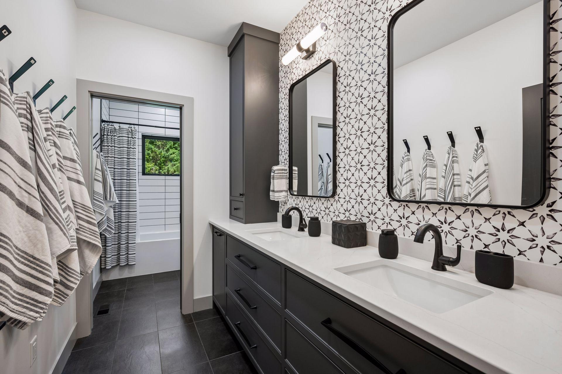 This spacious upper-level bedroom offers a private retreat complete with its own luxurious bath, accent wall and double sinks. All upper bathrooms feature in-floor hot water heat.