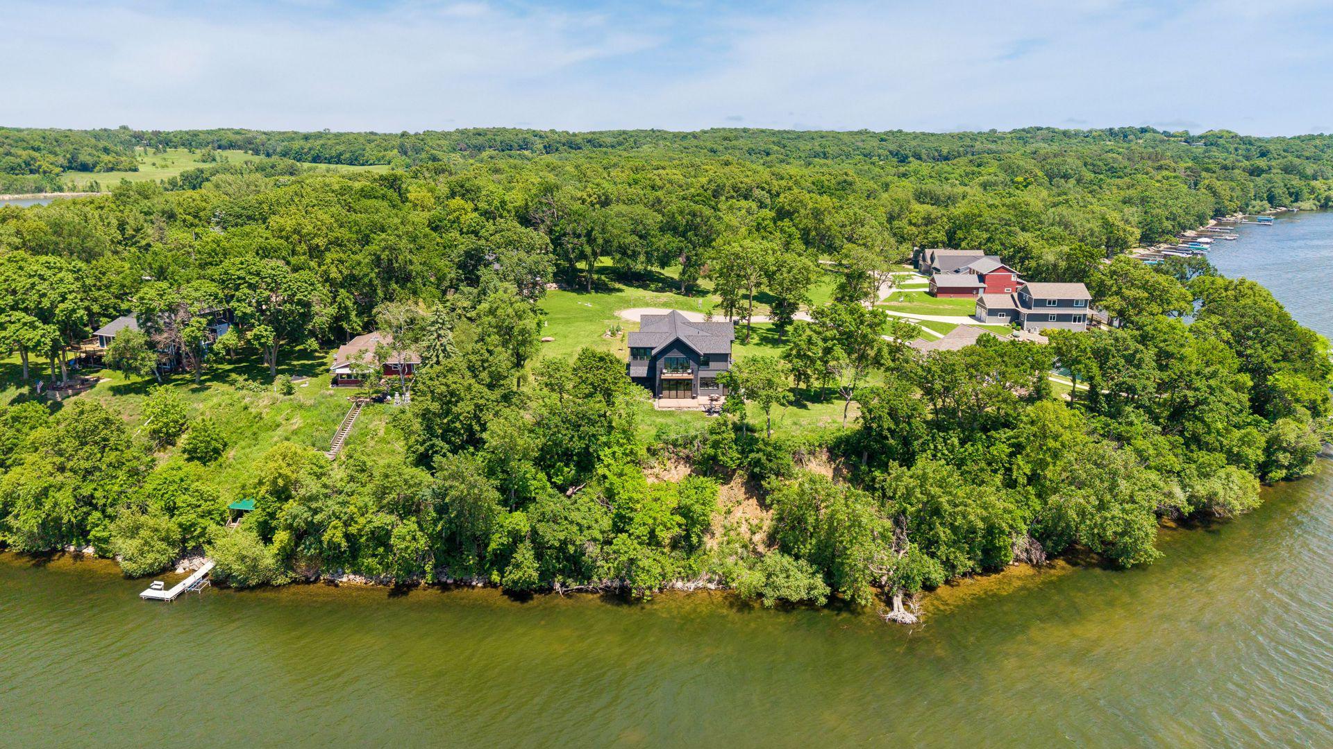 Perched atop a scenic bluff overlooking Lake Koronis, this remarkable setting offers exceptional privacy, panoramic water views, and unforgettable sunsets.