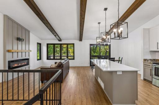Main floor living space with large windows and vaulted ceilings