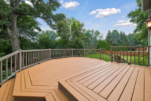 Outside, enjoy a spacious deck and patio overlooking the flat backyard, offering plenty of room for outdoor recreation and the potential for a future swimming pool.