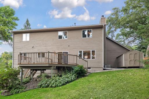 Additional highlights include an attached three-car garage and storage shed.