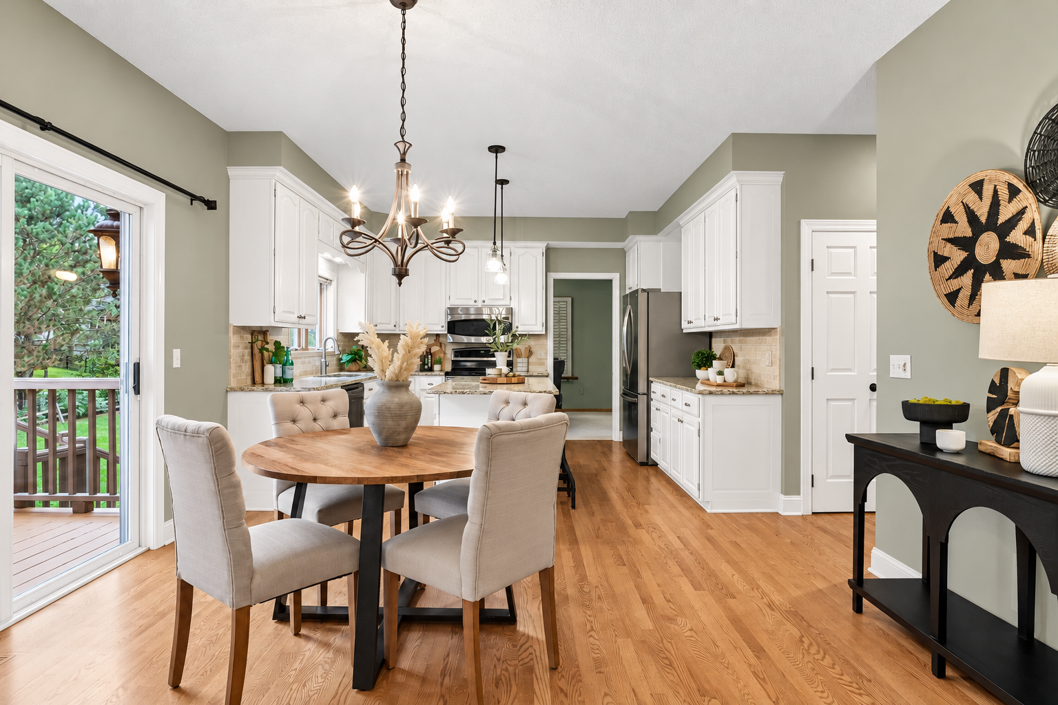 Photo has been digitally enhanced to illustrate how the kitchen could look with white enameled cabinetry.