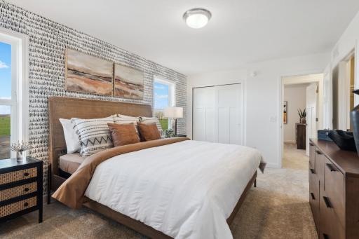 (Photo of a decorated model, actual homes finishes will vary) Another view of the primary bedroom.