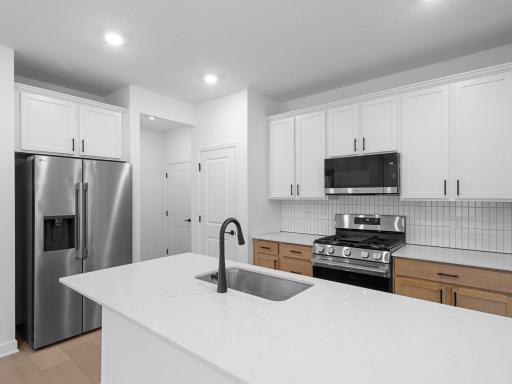 The kitchen is perfect for home cooks of all skill levels. It comes fully equipped with new stainless steel appliances, designer-selected cabinetry and a versatile center island.
