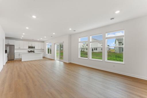 Open the adjacent sliding glass doors to bring in fresh air as you enjoy your meals in the dining area.