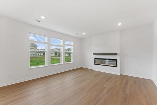 Located at the back of the home, the Great Room is perfect for cozy movie nights and entertaining alike with large windows to brighten up the space.