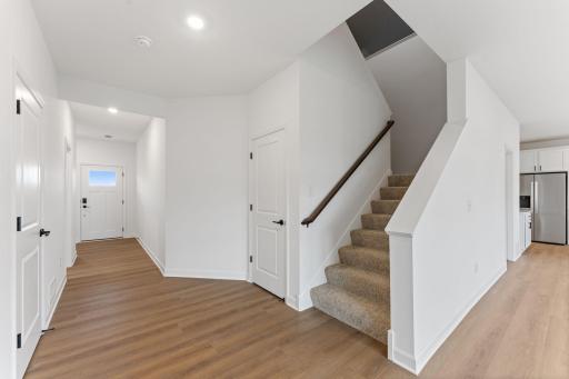 Ease of access from the main level to upper level living spaces in this open floorplan.