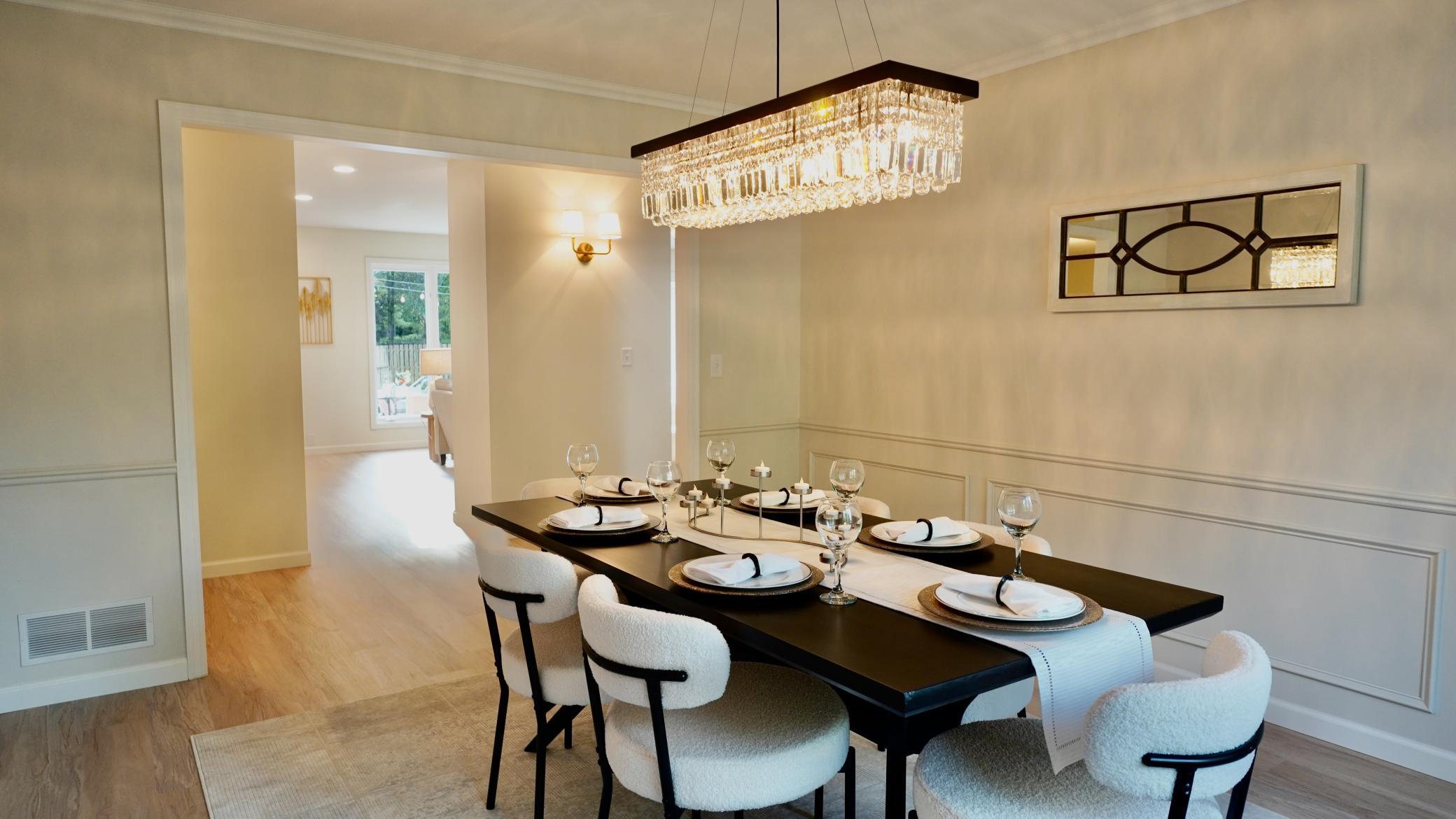 The sophisticated and stunning formal dining room, right off of the kitchen, can house a large dining table perfect for both dinner parties and holiday celebrations.