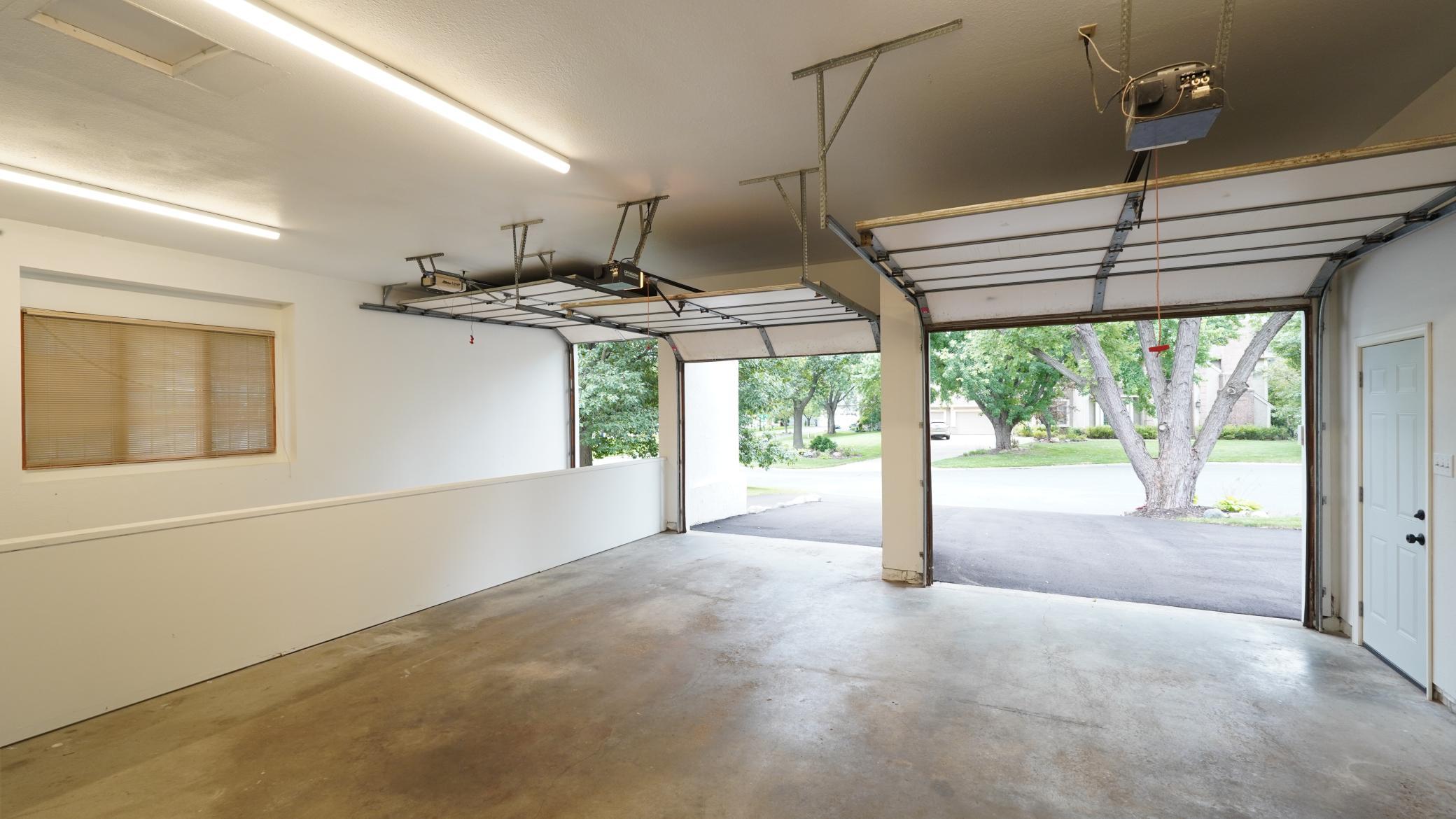 The generous three car garage features insulated, finished walls, three large LED work lights, baseboard heat, and a new passage door. The oversized third stall is separated by a pony wall.
