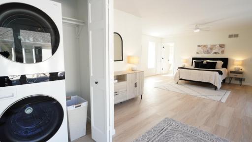 The generous primary suite includes a full sized, brand new wash tower and ample room for a seating area or furniture. This is the second washer/dryer system in the house; there is a full-sized set in the mudroom.