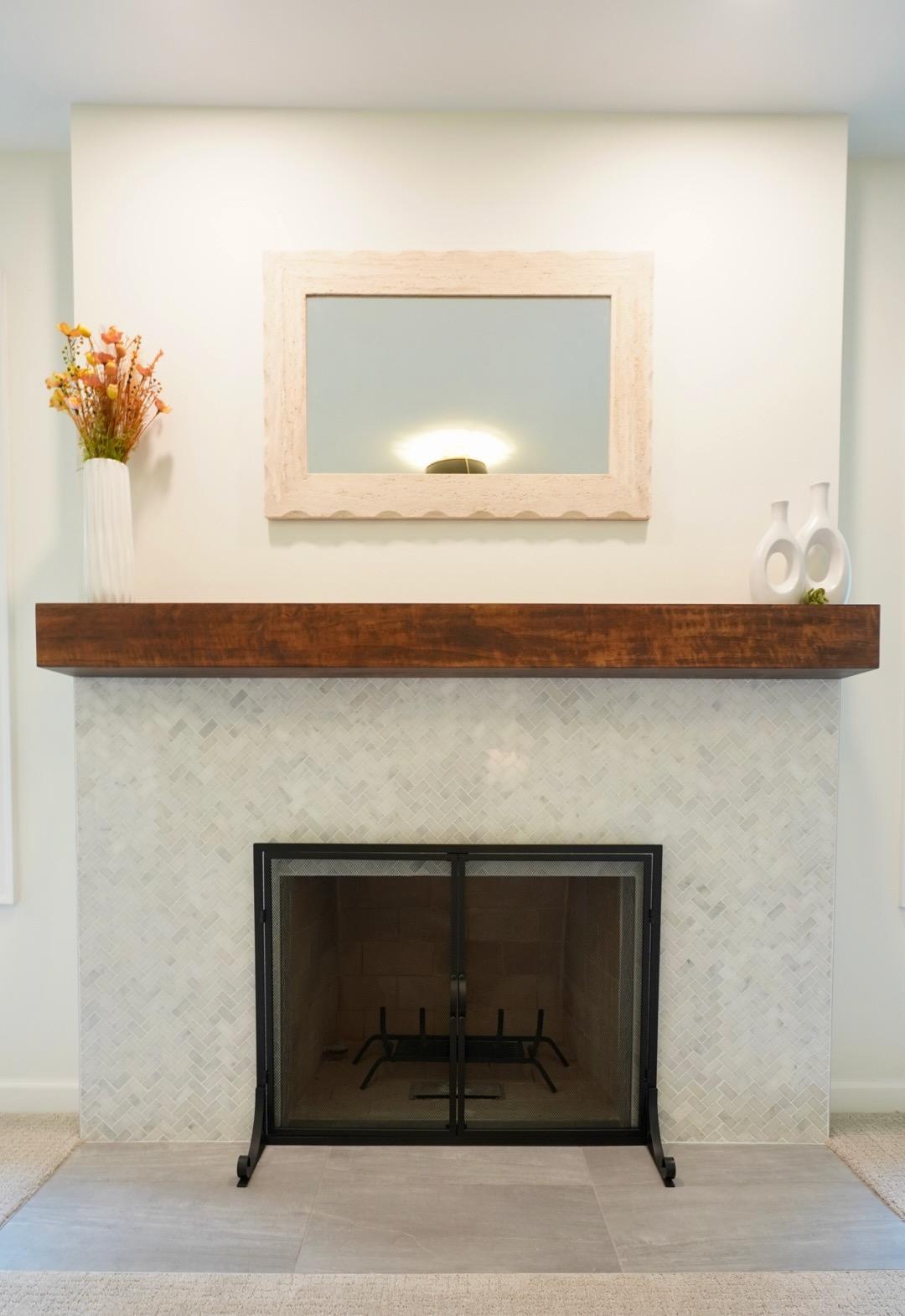 The wood-burning fireplace in Bedroom 2 has a gorgeous new tile surround, hearth and mantel, and includes a natural gas stub in the firebox for easy conversion to gas.