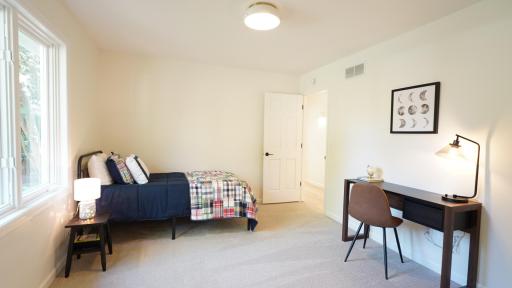 Bedroom 4 features large windows and ample space for furniture.
