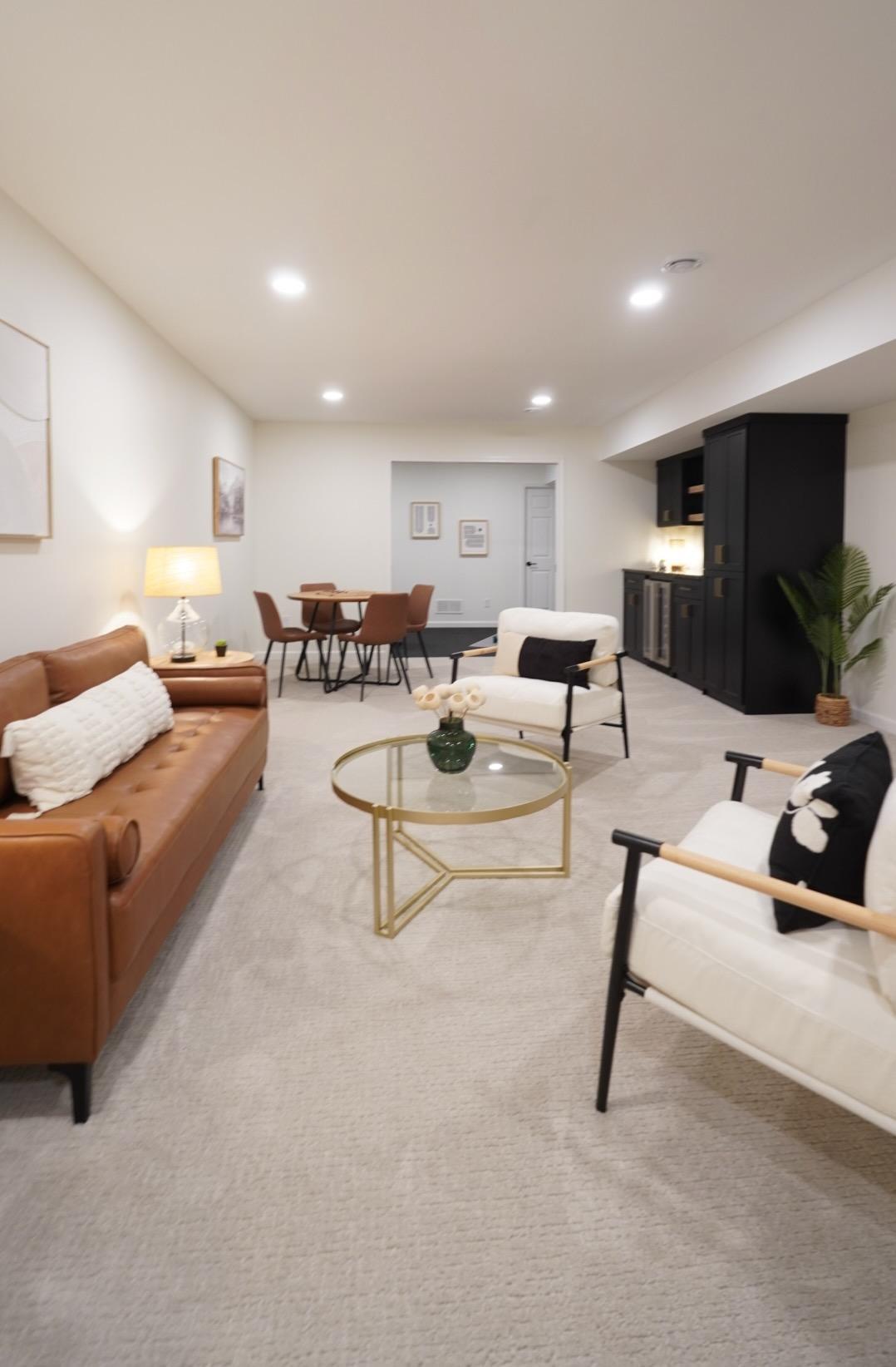 The newly finished family room added approximately 1000 square feet to the house's total, and is the perfect place for watching movies, family game night, or exercising in the newly added workout room.