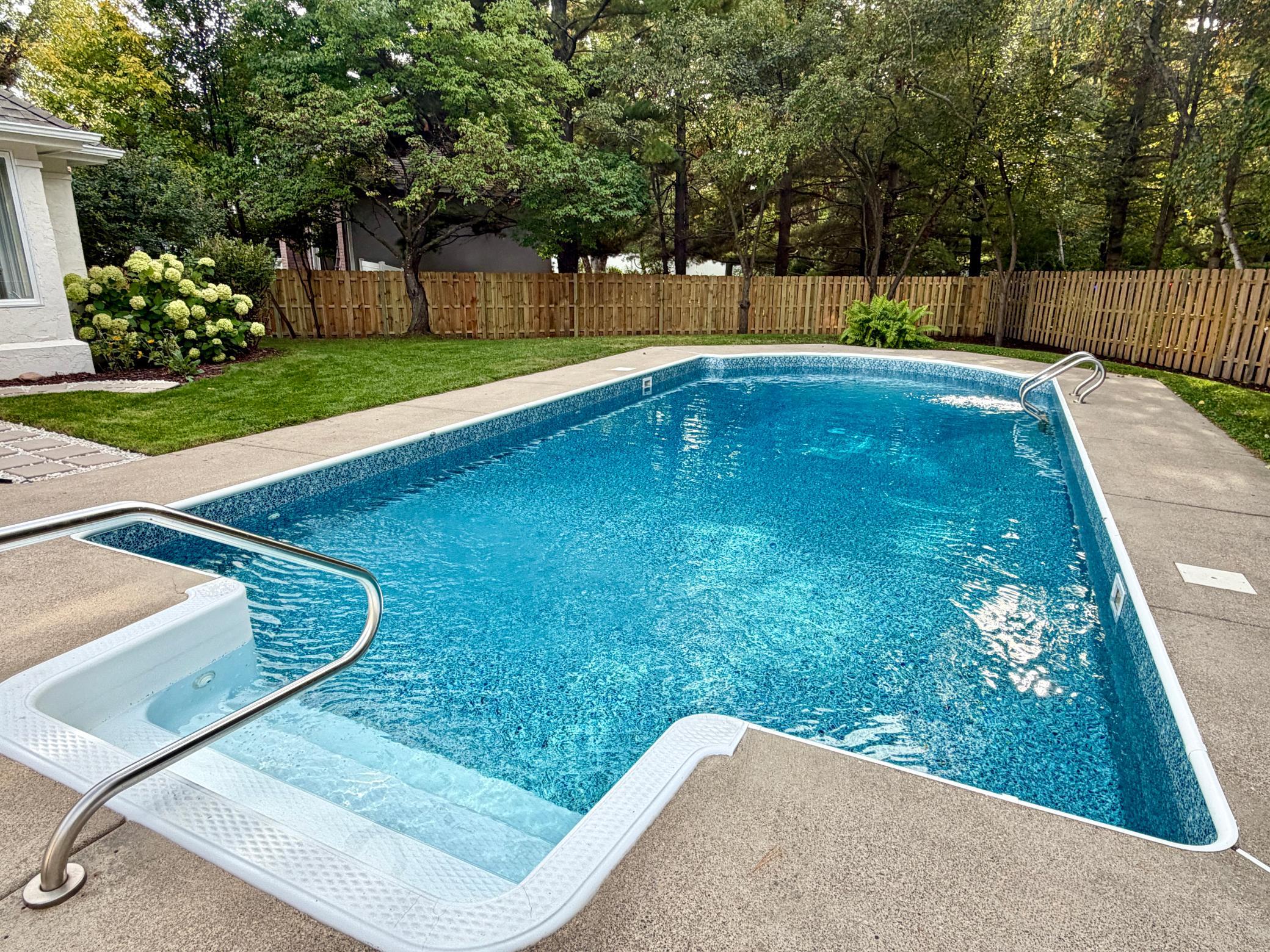 The renovated pool was just renovated with a brand new 27 mil liner and a brand new filtration system. The far end is nine feet deep and may have previously had a diving board.