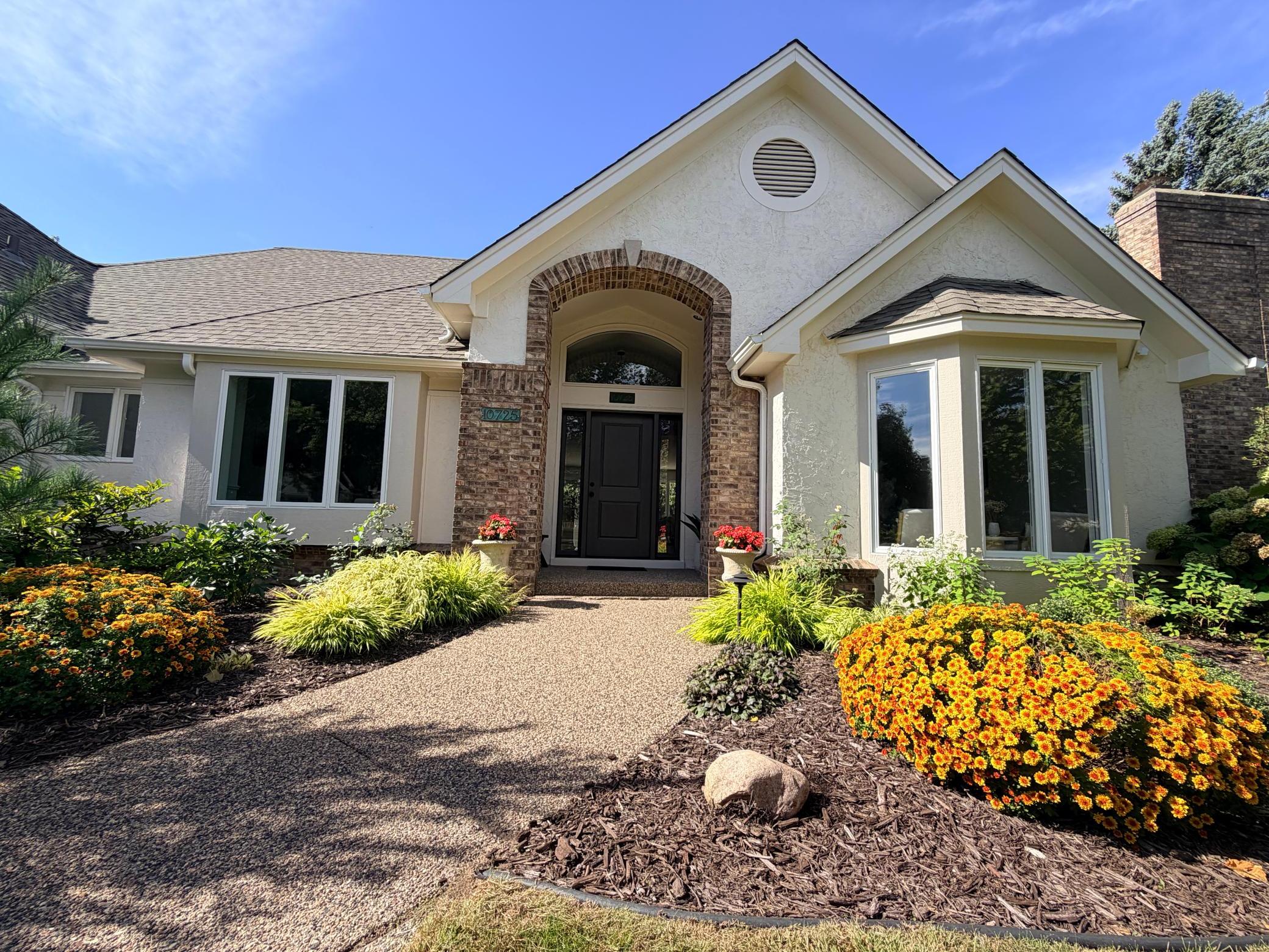 10725 Purdey Road is a sprawling, one story, destination home that exudes curb appeal with a grand entry, brand new roof, fresh exterior paint, mature landscaping with accent lighting and a sprinkler system, and a side-load garage off the cul-de-sac.