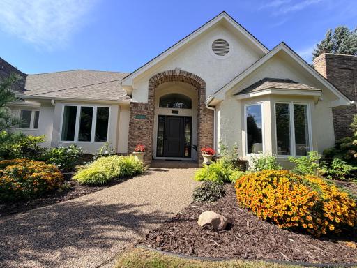 10725 Purdey Road is a sprawling, one story, destination home that exudes curb appeal with a grand entry, brand new roof, fresh exterior paint, mature landscaping with accent lighting and a sprinkler system, and a side-load garage off the cul-de-sac.