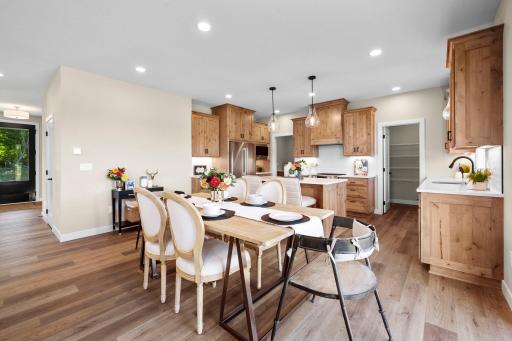 Dinning room looking into kitchen showing the walk in pantry and garage entry