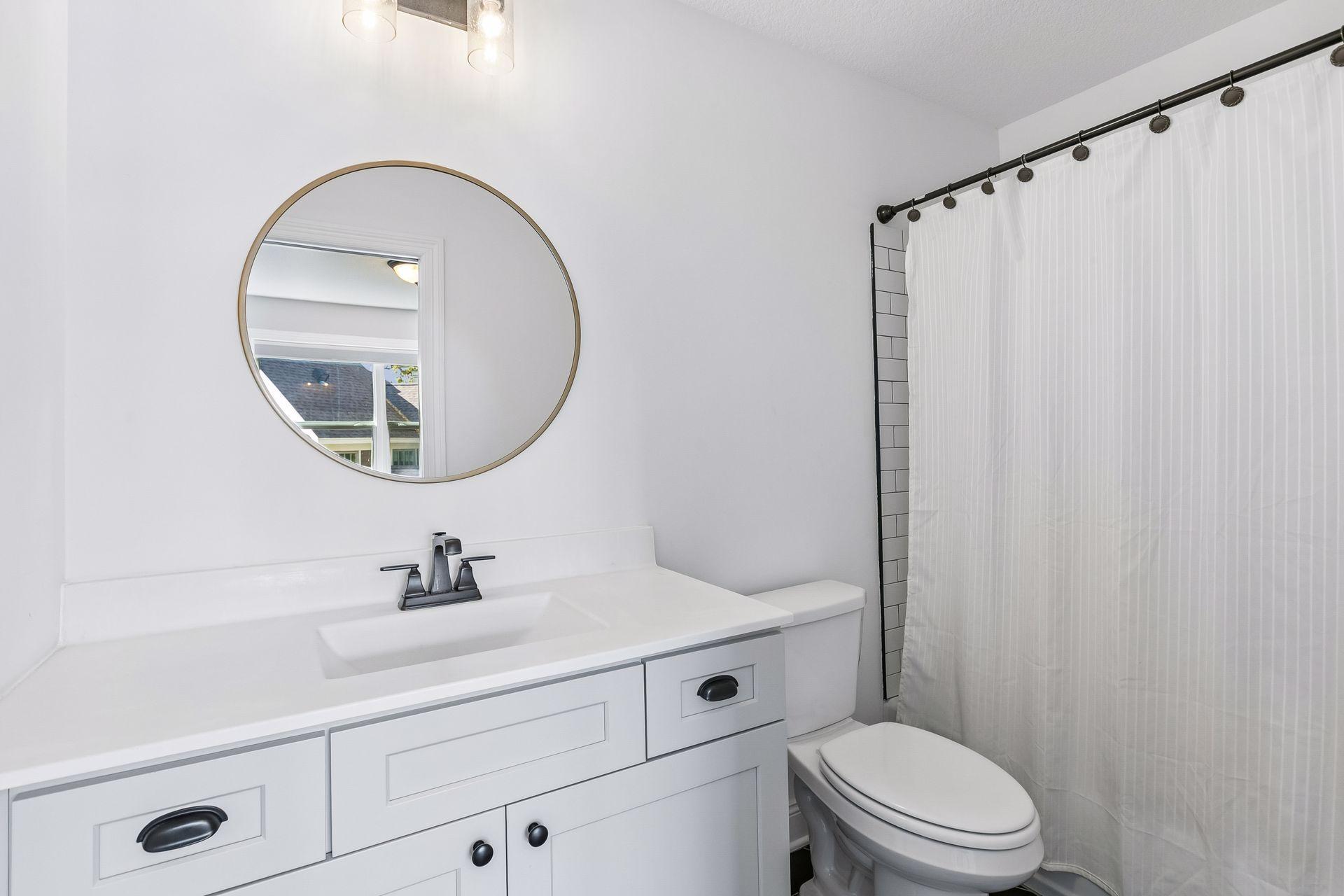 Private ensuite bath adjoining bedroom four.