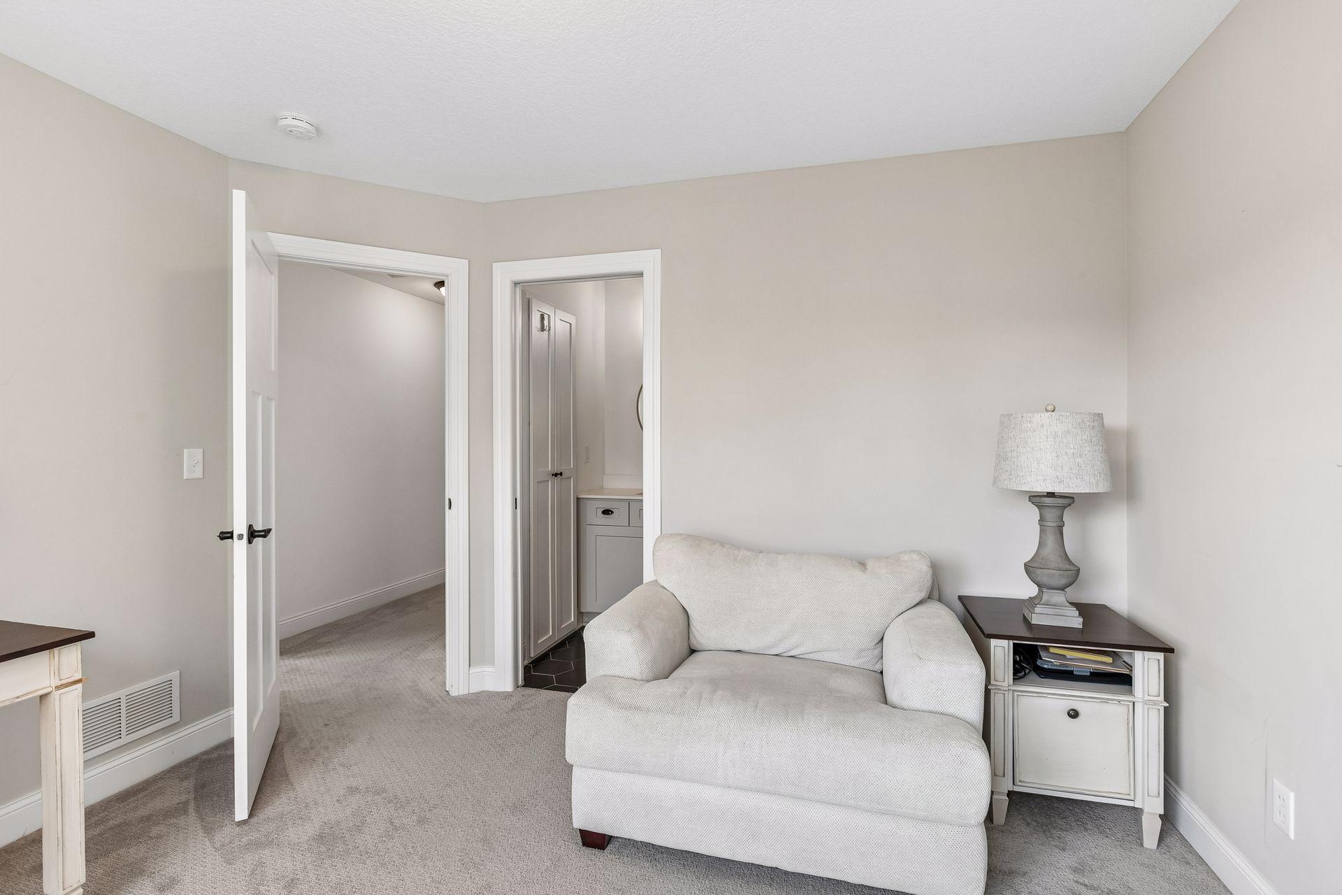 Bedroom four features a private ensuite bath and is currently used as a second home office.