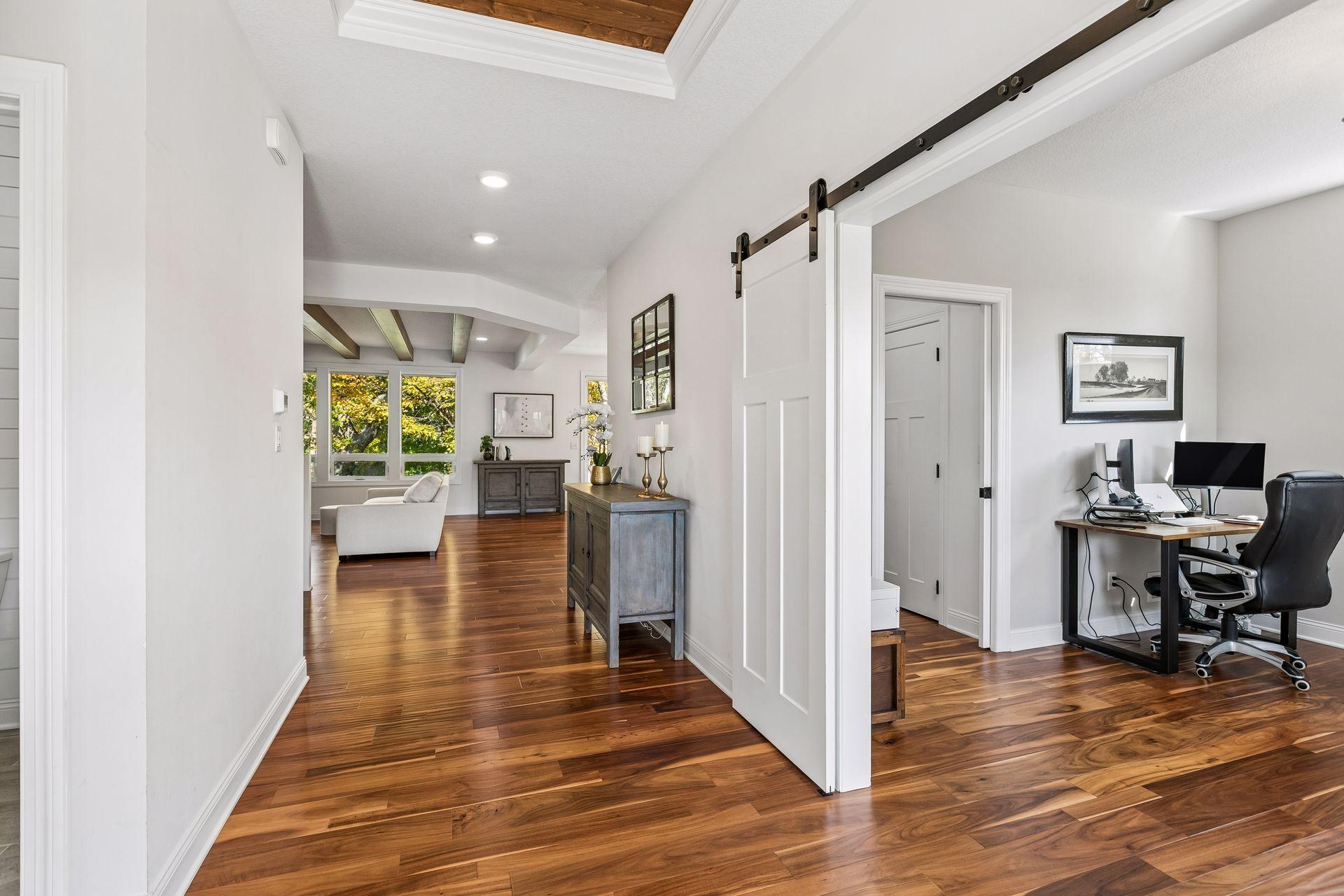 Entryway opens to the home office and inviting family room.