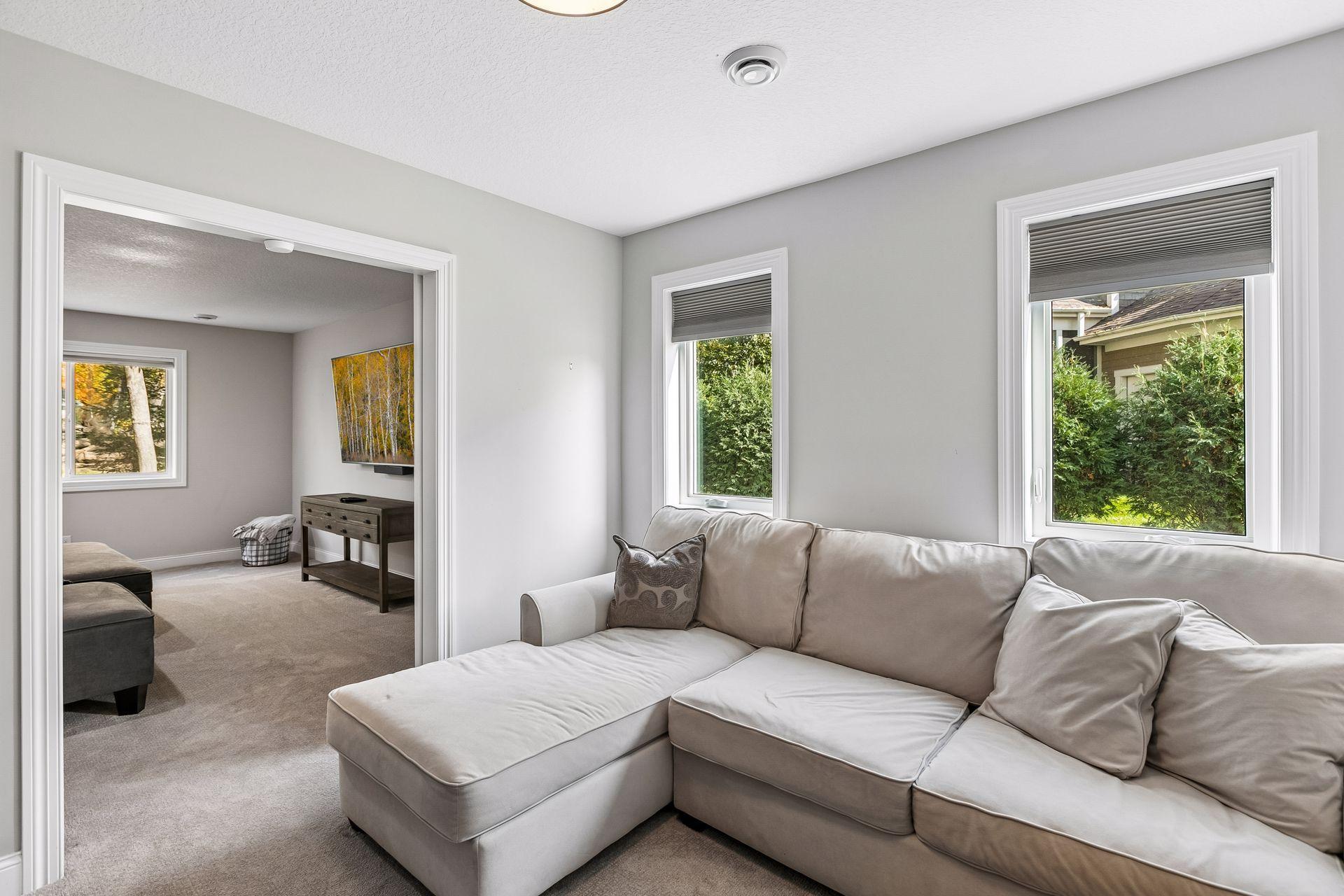 Flex room currently used for gaming offers versatile space for a playroom or exercise room.
