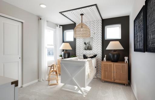 The Ashton also features two large guest bedrooms perfect for any use! Photo of model home.