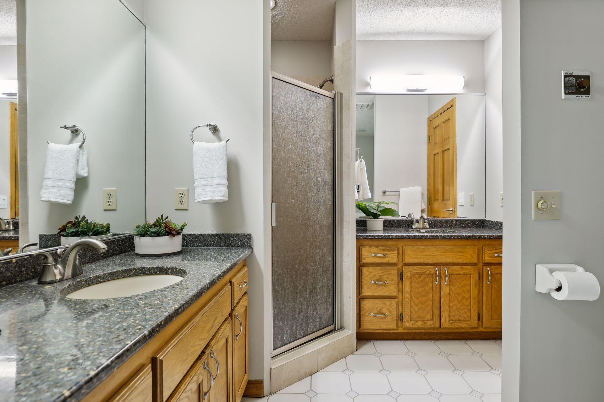 Two separate vanities and shower