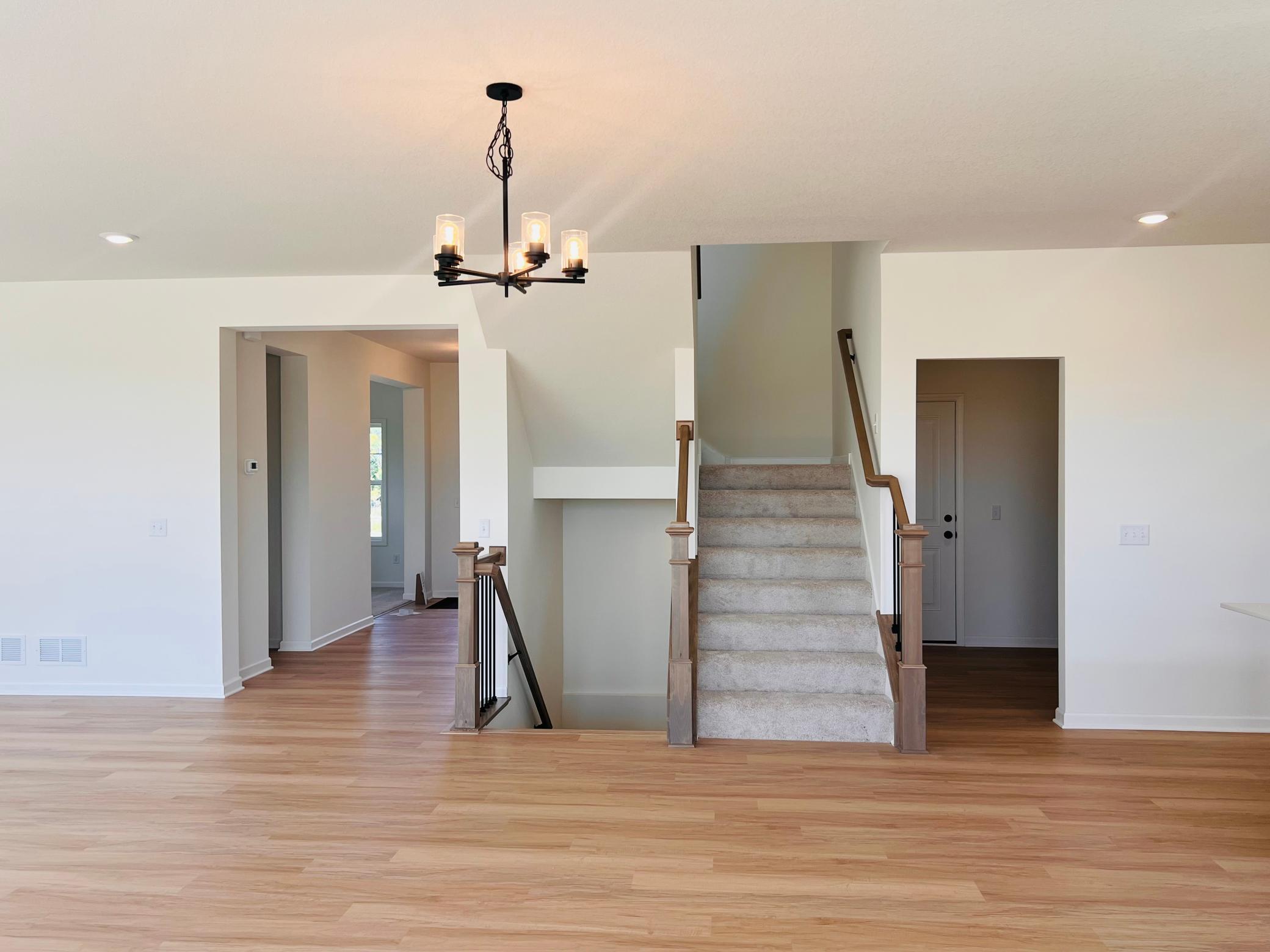 Stairs that lead up and down to completed basement. All Pictures are for Illustration Only.