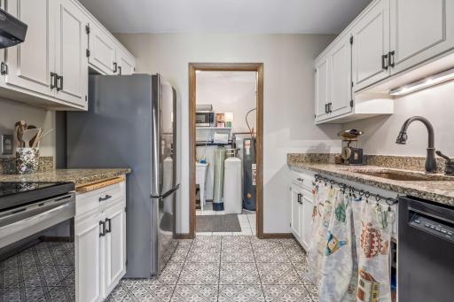 Kitchen has a pocket door to the utility/laundry and leading out to the garage.
