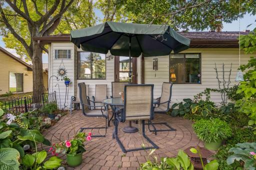 Updated patio with decorative fencing, and green space. Sellers made this place an outdoor retreat you'll love to hang out at.