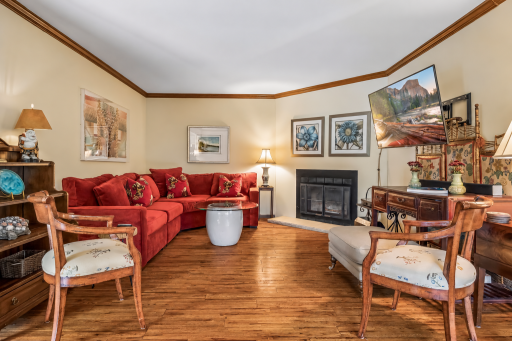 Cozy Living Room with fireplace, Crow molding and a great place to entertain.
