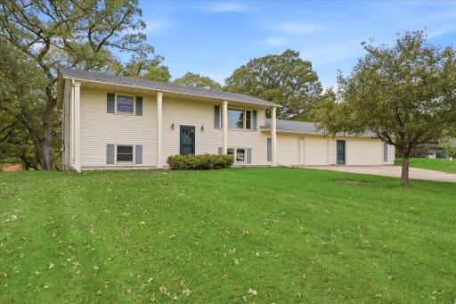 Beautiful exterior view showcasing the homeâs stately pillars and low-maintenance metal siding.